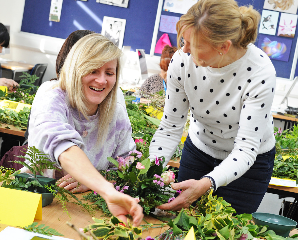 Adult students in a floristry class