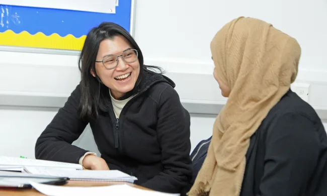 Female ESOL students working in classroom